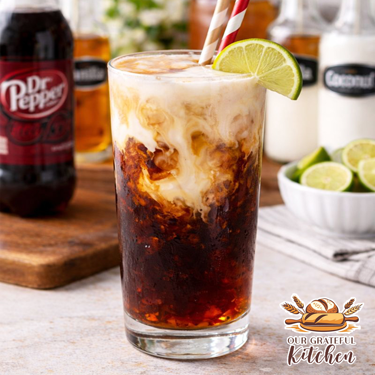 Creamy dirty Dr Pepper with coconut and vanilla served over ice with a fresh lime garnish