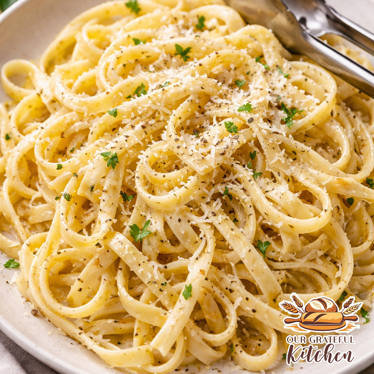 Garlic butter pasta made with fresh homemade pasta, tossed in melted garlic butter and topped with parmesan cheese and cracked black pepper.