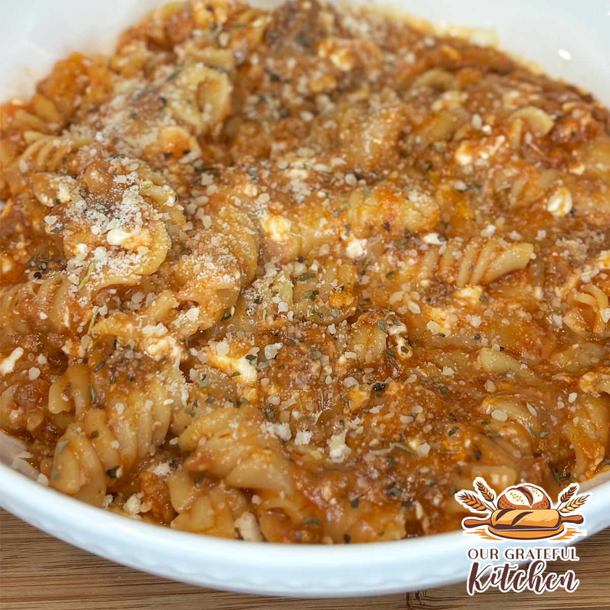 Instant Pot lazy lasagna with rotini pasta, ground beef, tomato sauce, cottage cheese, and melted mozzarella.