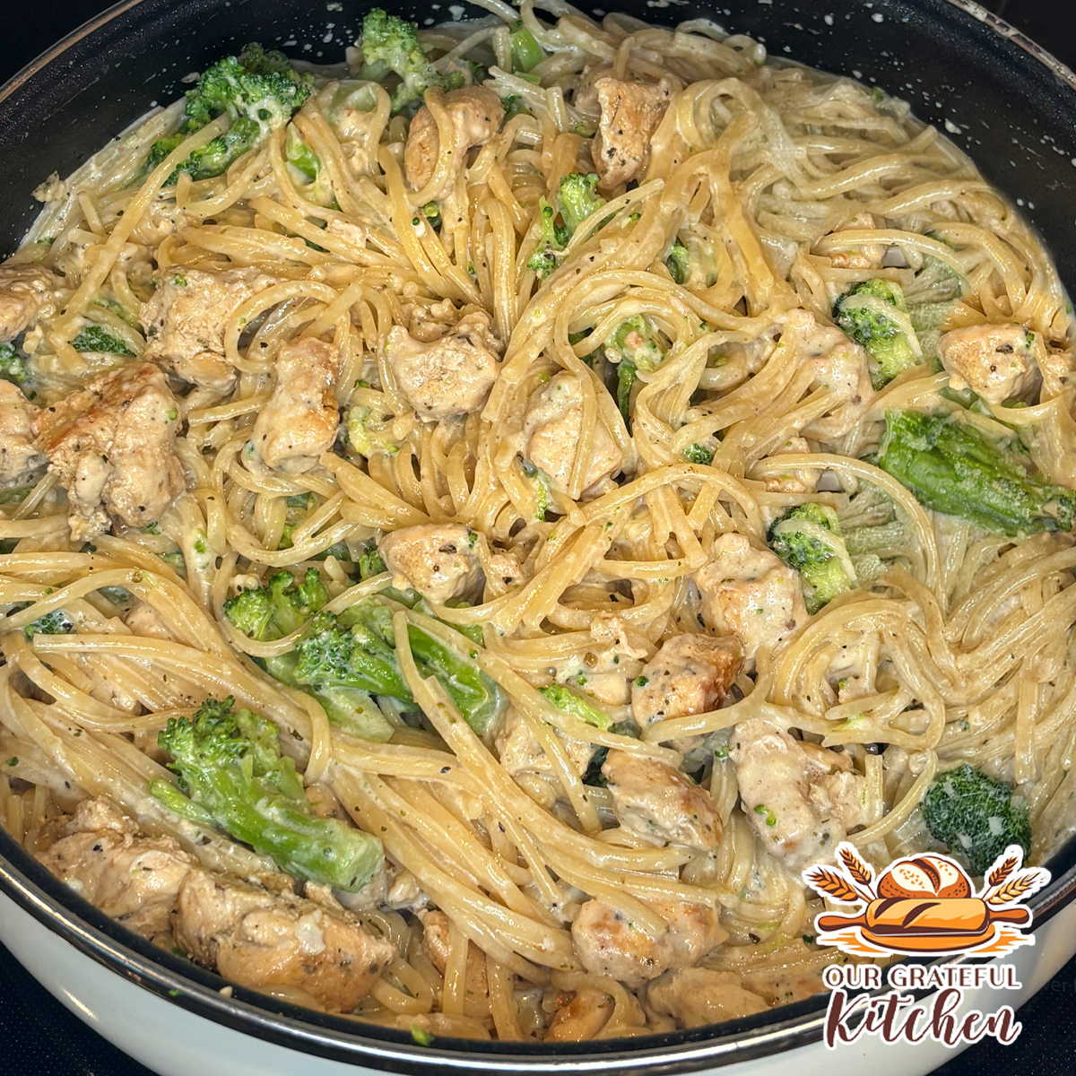 One pot creamy garlic chicken pasta with broccoli in a skillet