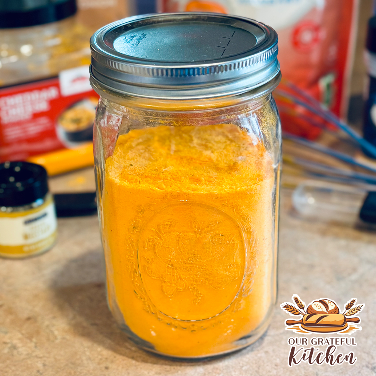 Homemade mac and cheese dry mix stored in a glass jar on the kitchen counter