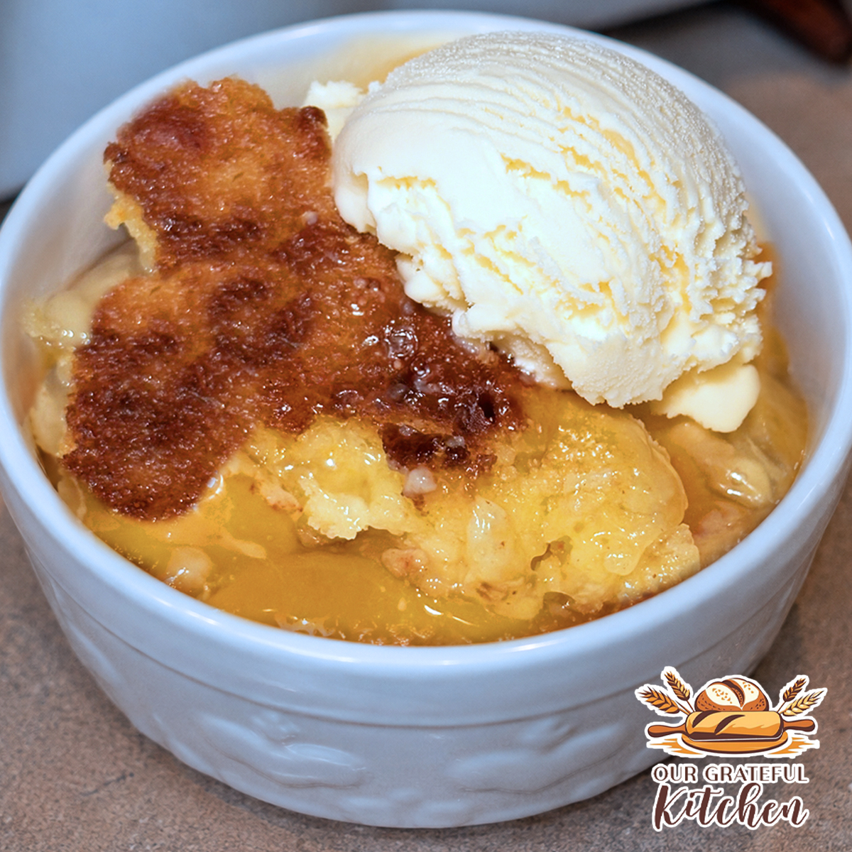 Easy peach dump cake with peach pie filling, golden cake mix topping, and vanilla ice cream